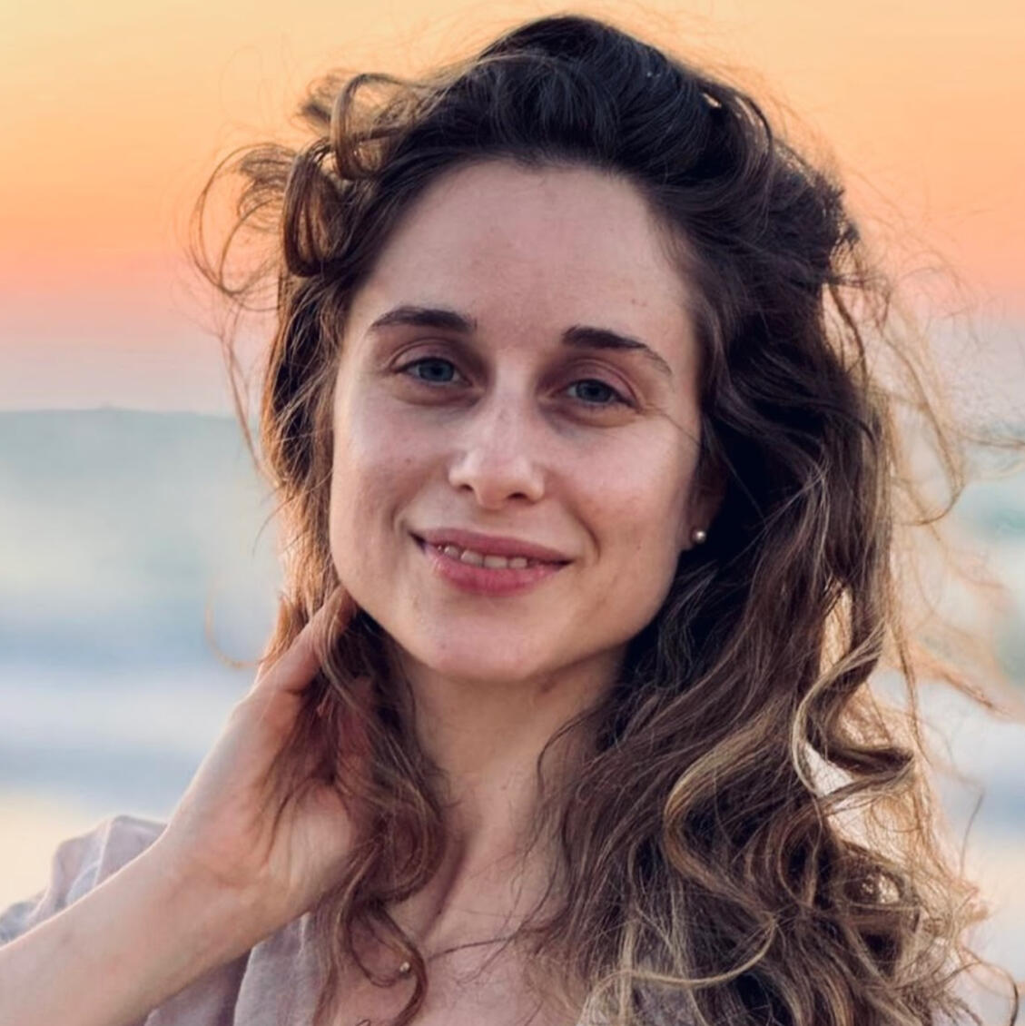 Maryandra Portrait of Maryandra, a compassionate wellness practitioner with long, flowing hair, wearing simple, natural attire. Her gentle smile reflects her dedication to creating sacred, healing spaces. Surrounded by elements of nature, she exudes a serene, ground